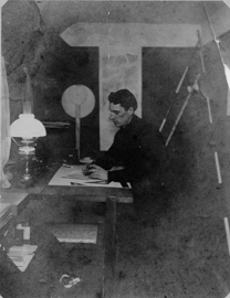 Tomhu working in his home studio.